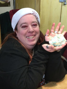 Portrait of Amy Vanderlan, Ed's granddaughter, holding an amazonite specimen